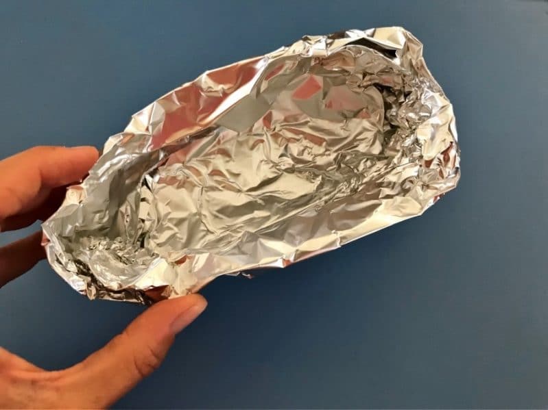 Scrunching aluminum foil for your book based science experiment is a great fine motor skill!