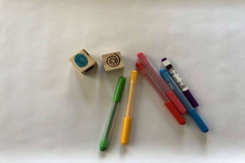 Use your Art Dice and basic art supplies to play an art-based game that boosts early writing skills.