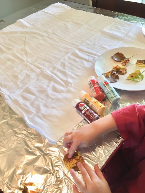 Make a colorful leaf stamped tablecloth! Your kids will love creating their very own tablecloth for Thanksgiving.