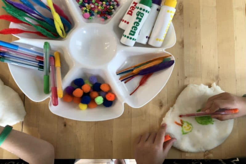 Your child will love coloring on play dough in this easy and fun sensory art activity!