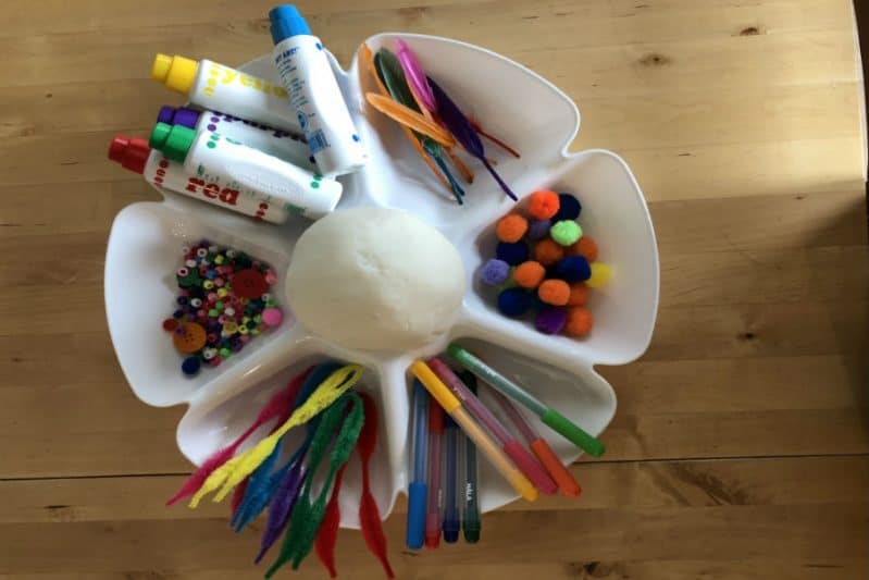 Use crafts supplies you have on hand for a simple sensory play dough art activity!