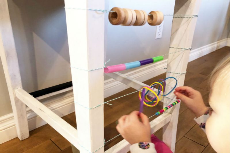 Use objects around your house to practice toddler counting skills with a DIY abacus.