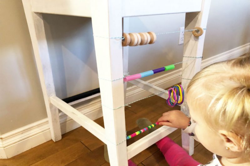 Use beads and other O-shaped objects to make a DIY abacus for your toddler!