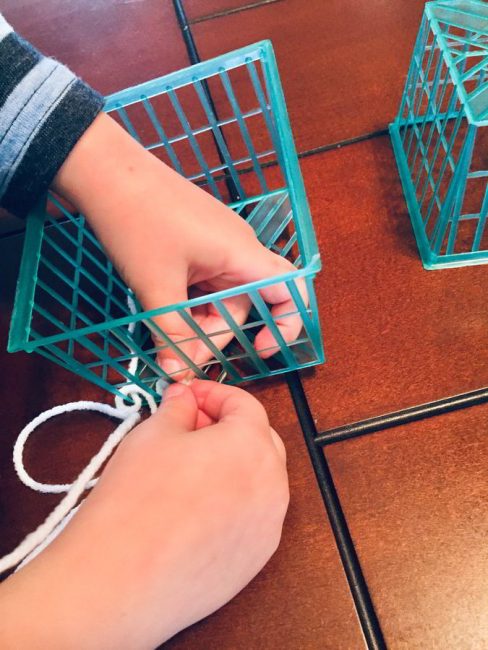 This simple woven strawberry basket craft is perfect to hold your child's favorite toys or collections! Make this hands-on woven craft with just a few simple materials.