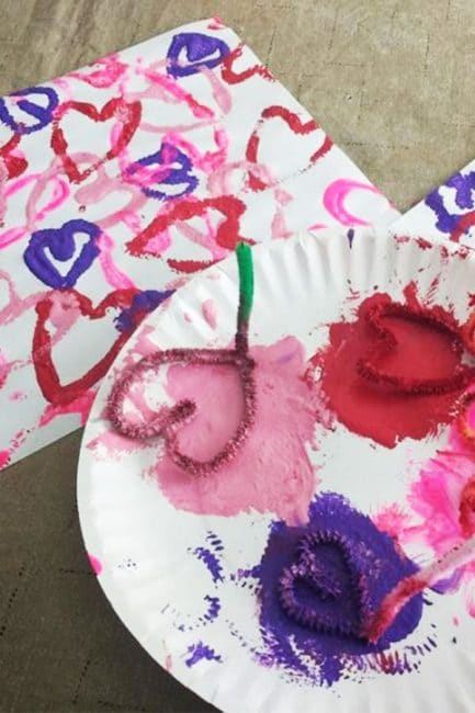 Make beautiful at for Valentine's Day with stamped hearts made out of pipe cleaners!