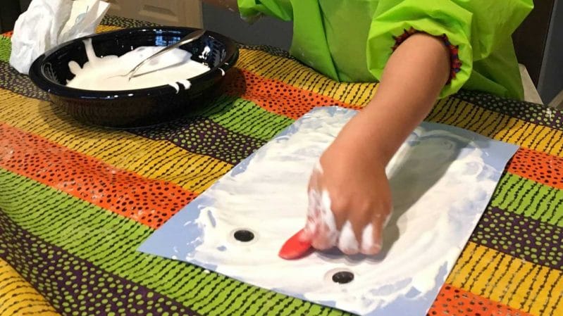 Squish around DIY snow paint to make your own melting snowman in this fun spin on a traditional winter craft activity. Indoor winter fun!