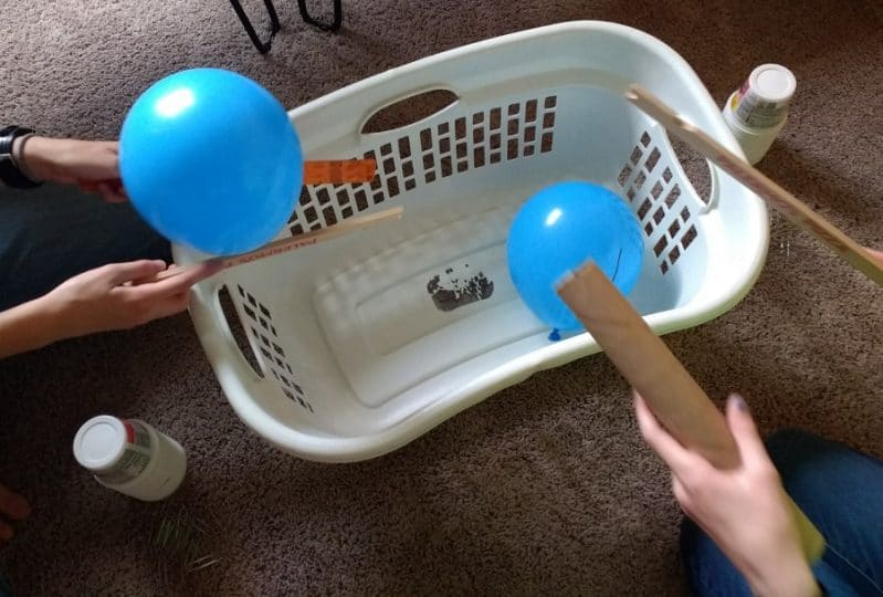 How will your kids move and pop the balloons? Try different methods and see which one works best!