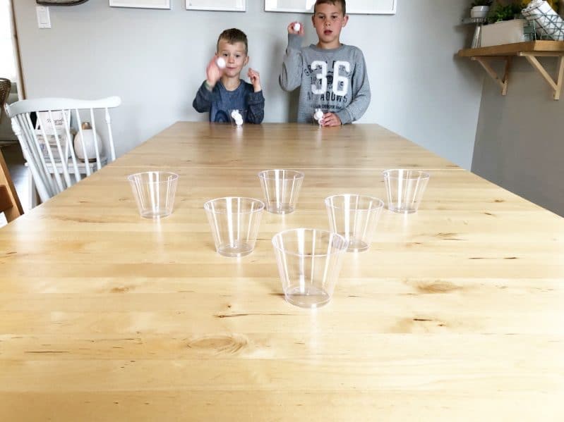 Toss, bounce, and catch the ping pong ball in a cup!