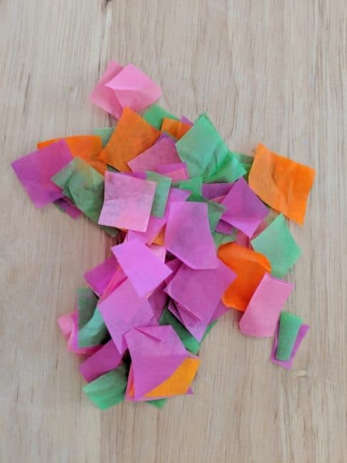 Use tissue paper to add a pop of color to your Mother's Day necklace craft.