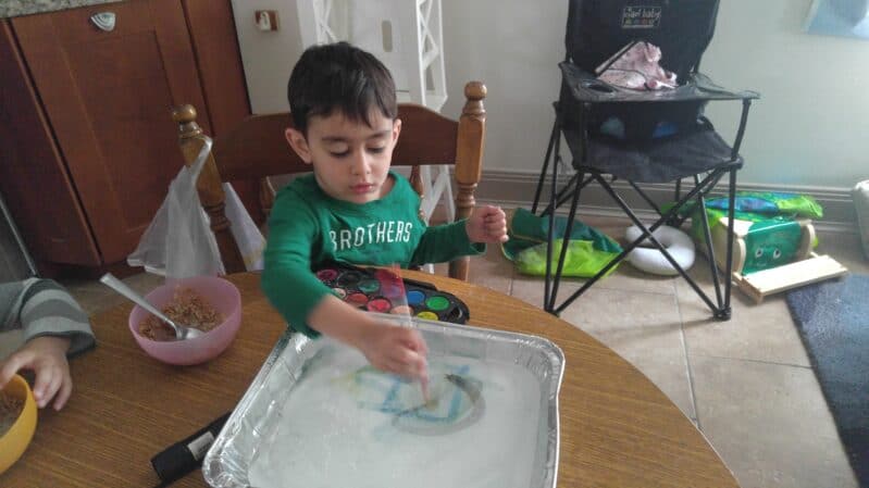 Do a little ice painting with your child! It's a simple, easy to clean up art + science experiment!