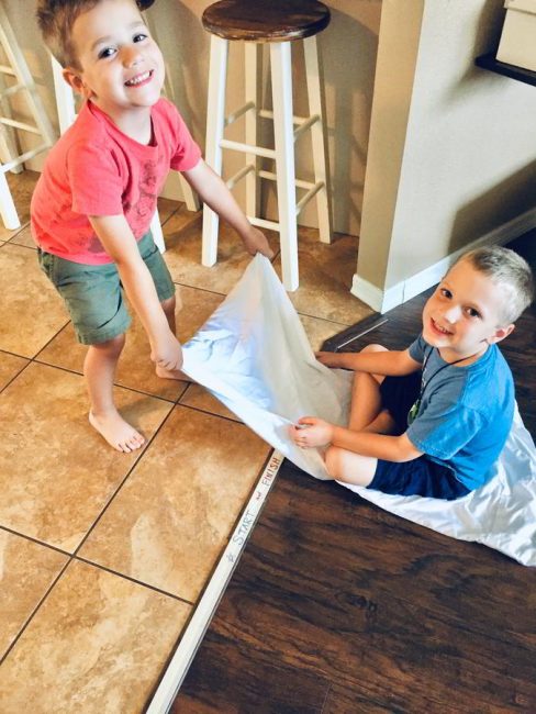 This scooting pillow case race is the perfect solution for indoor gross motor fun! Your kids will love this fast-paced indoor play challenge!