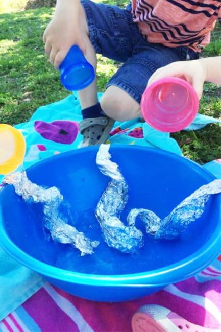 Use tin foil to make your own DIY water play activity! It's a great way to cool down in the heat of summer!