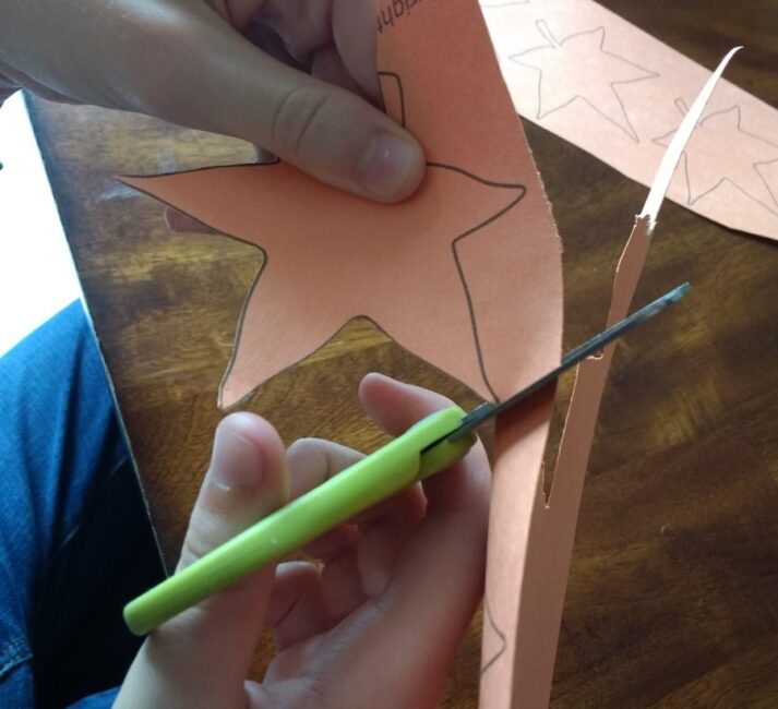 Cutting out fall leaves is perfect for fine motor skills practice!