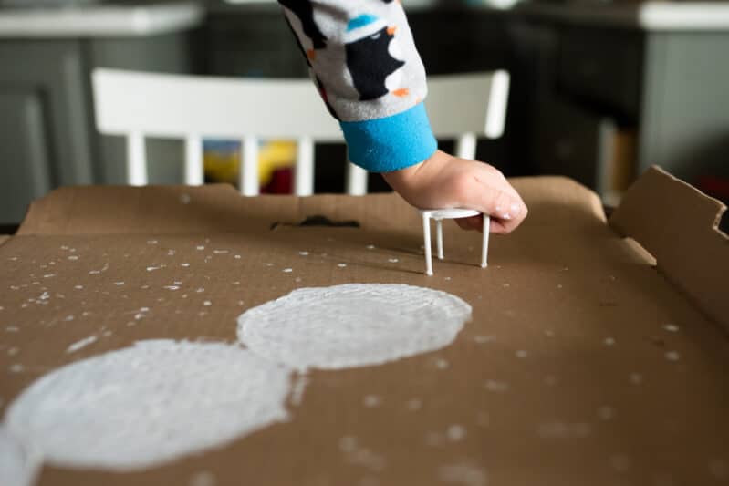 A recycled snowman painting project for kids is a perfect winter craft!