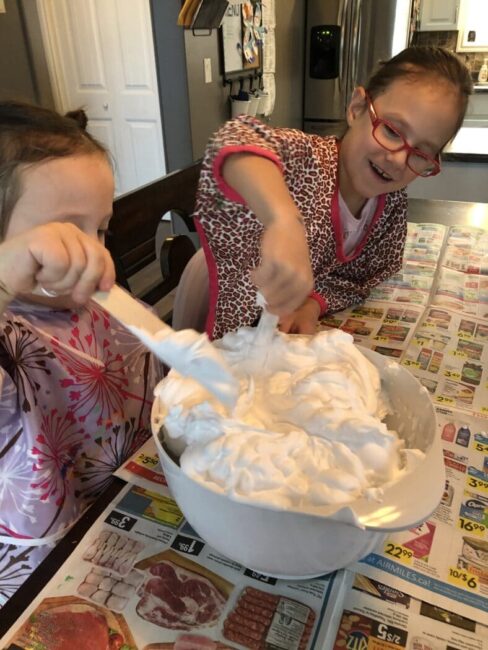 Mixing up a shaving cream sensory experience together for inside winter fun