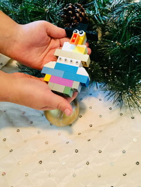 Make mini LEGO snowmen with this winter-themed LEGO build challenge!