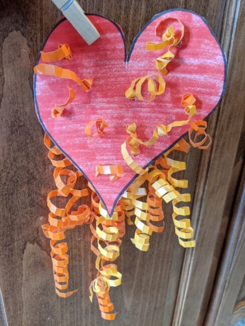 Hang your ribbon heart fine motor craft for kids to make in your house for Valentine's Day!