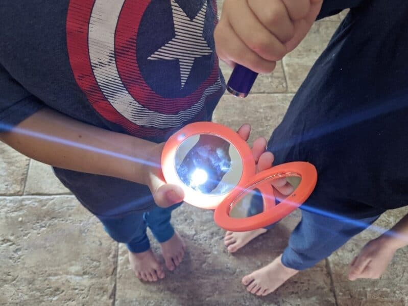 Check to see what objects reflect with easy light experiments for kids