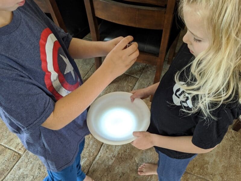 Check to see how light acts with a plate in this easy experiment for kids.
