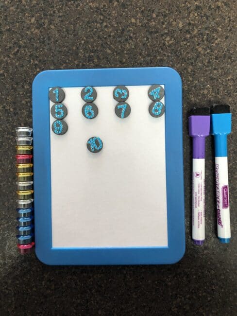 Use a magnet white board for fun no-screen ways entertain kids on a plane!
