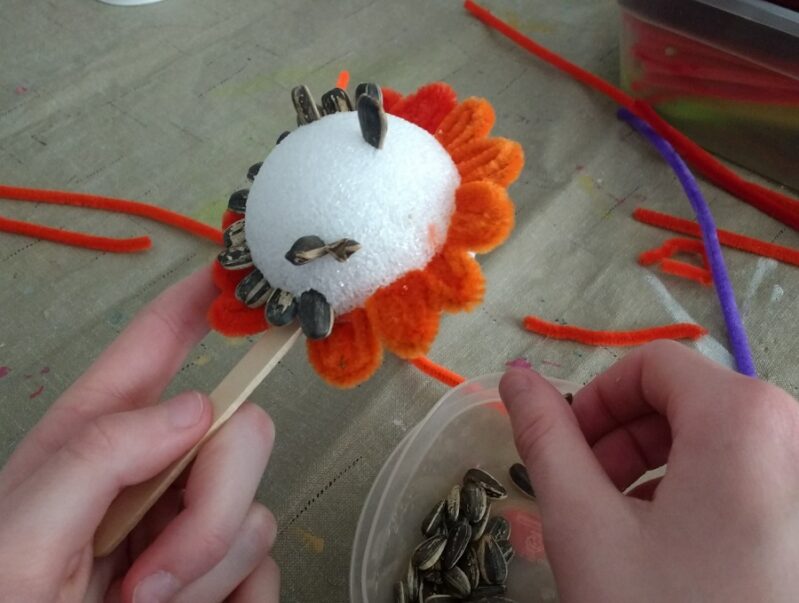 spring flower craft with sunflower seed centers
