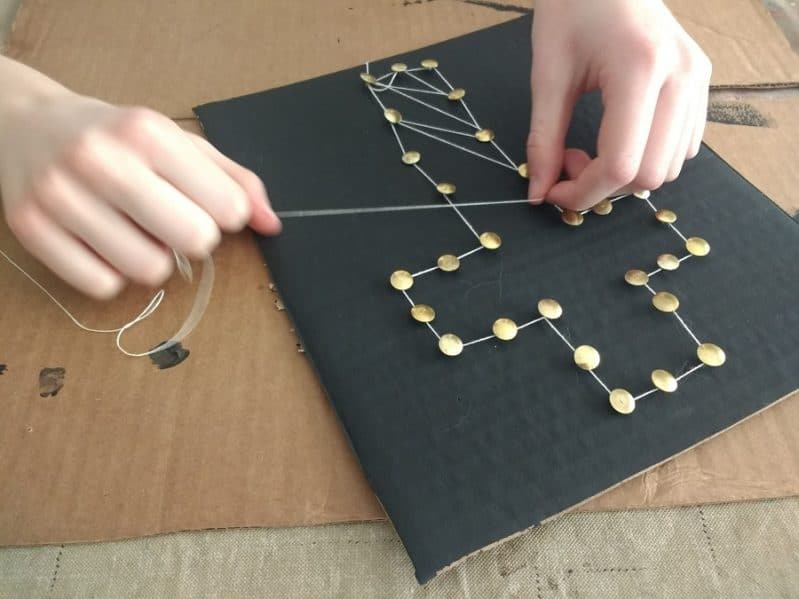 String art can be simple or intricate, your child can choose how to do it! Just trace the shape with the string, or criss cross between.