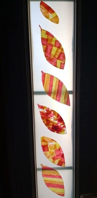 Capture the colors of fall with this super simple leaf suncatcher craft for kids. Display your beautiful tissue paper leaves all season long!