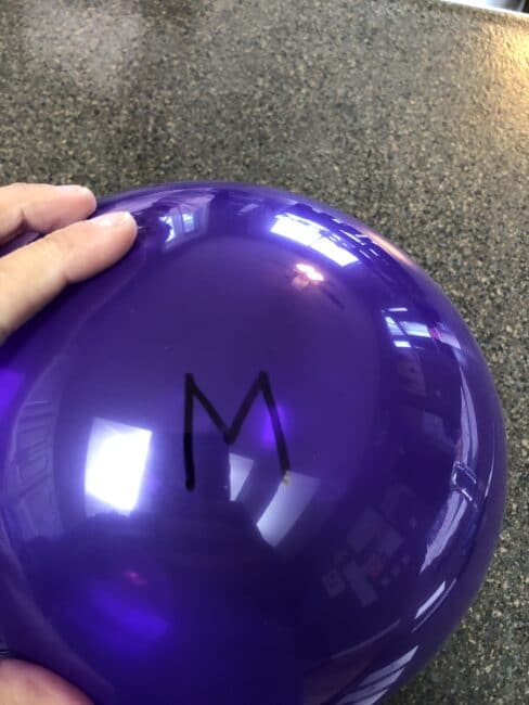 Write the matching letter on the outside of the balloon for popping activity
