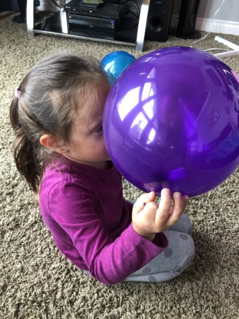 Finding the letters to spell your name in the balloon pop activity.