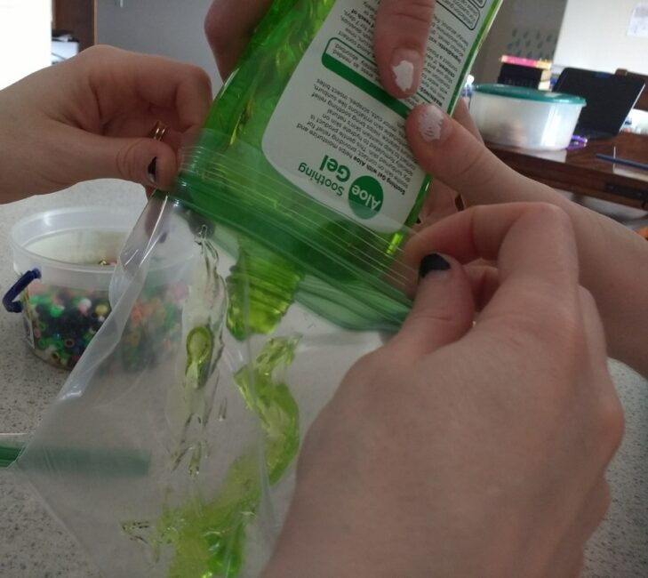Pouring gel into resealable sandwich bags.
