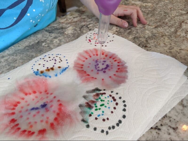A no prep paper towel tie dye art for kids to enjoy drawing patterns and create a tie dyed treasure with just paper towels, markers and water!