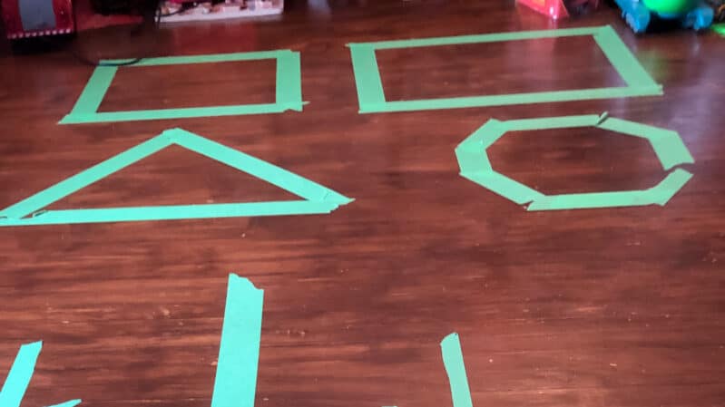 Super fun bean bag toss shapes activity to do at home with your kids!