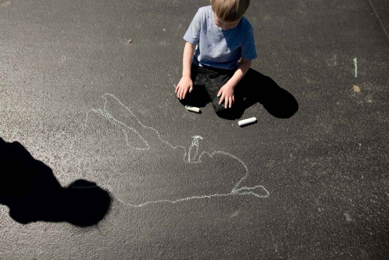 Chalk drawing activity for kids using shadow tracing as inspiration
