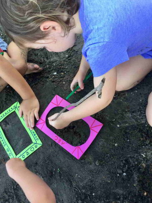 Kids sand drawing activity for the sandbox