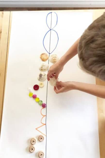 Challenge you kids with a symmetry activity using loose parts from around the house. Practice basic math skills while creating a fun little piece of art!