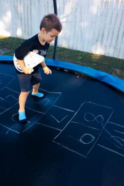 Looking for a fun gross motor game remix? This trampoline hopscotch game is easy to set up and so much fun for kids! 