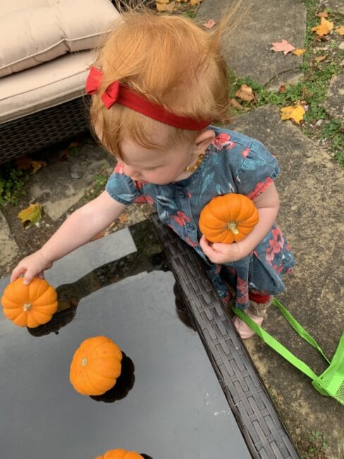 Keep baby sister busy with pumpkin play time.