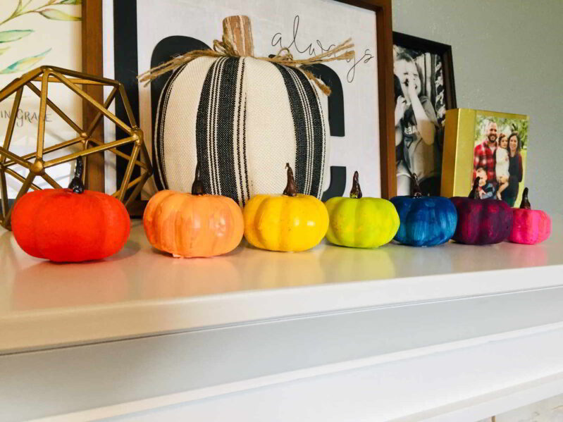 Brake out the craft paints and make the cutest rainbow painted pumpkins for kids! These colorful pumpkins are so easy and fun to make.
