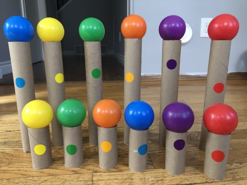 A quick and low prep fine motor activity to teach colors using ball pit balls in a balancing and color matching game for kids of all ages!