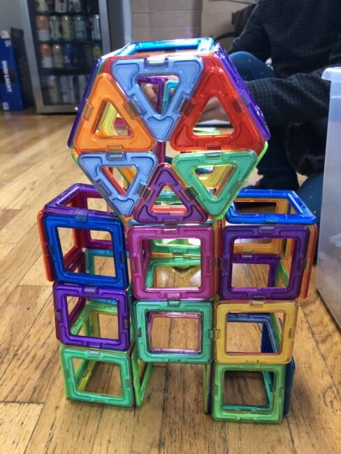 Make a robot with magnetic tiles and loose parts for creative fun with toddlers and preschoolers. Have a scavenger hunt for magnetic items too