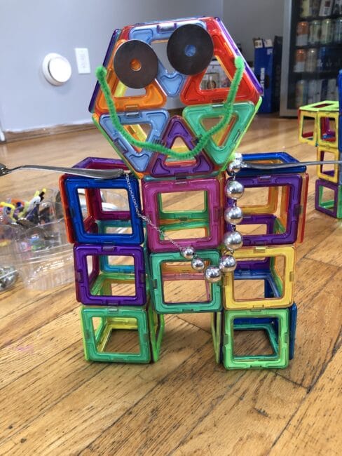 Make a robot with magnetic tiles and loose parts for creative fun with toddlers and preschoolers. Have a scavenger hunt for magnetic items too