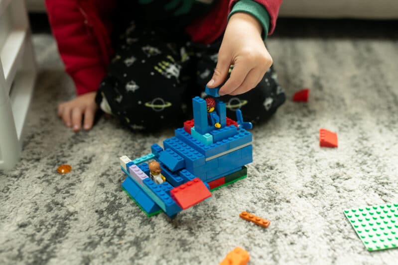 Fine motor creative play with Christmas LEGO block challenge for kids.