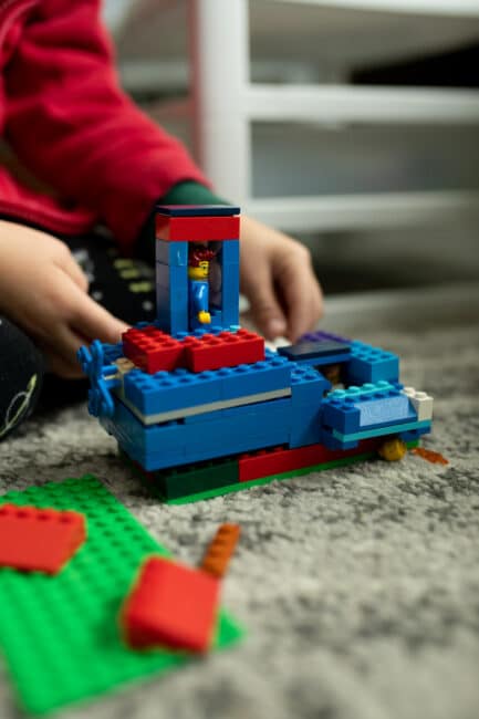 Super simple fine motor creative play Christmas LEGO Masters challenge for kids to do at home. 