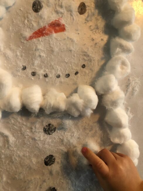 Work on fine and gross motor skills as well as creativity with a simple cotton ball snowman activity perfect for toddlers and preschoolers.