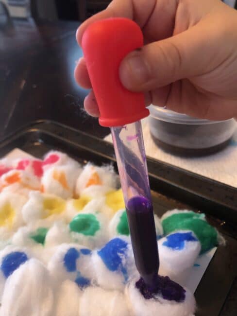 Make rainbow art with cotton balls and let your toddler or preschooler engage those fine motor skills while being colorful and creative.