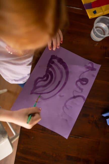 Writing and painting with water on construction paper