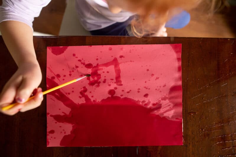 Splatter paint with water construction art activity for kids.
