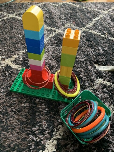 Super simple DIY ring stacking toy activities for baby or toddler using items you have at home. Easy fine motor activities for toddlers.