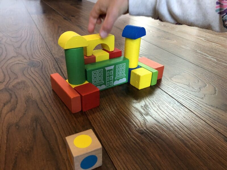 A super simple way to add learning colors with matching and teaching math into your classic block tower building activities with your toddlers and preschoolers at home.