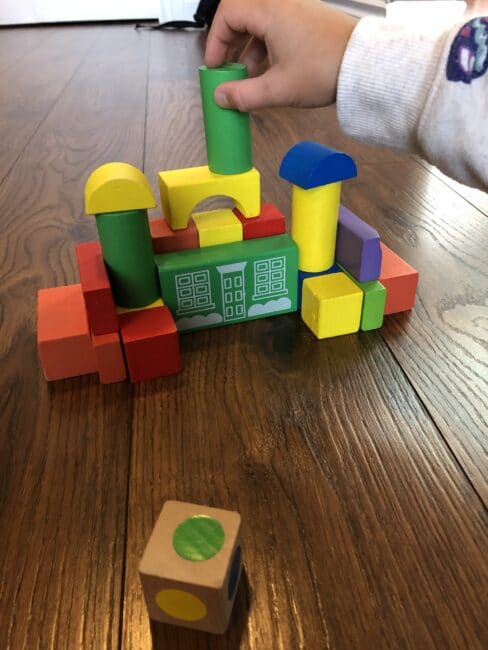 Blocks, dot stickers and dice are all you need to create your own building block towers activity that not only works on fine motor and cognitive thinking, but also learn colors and teach math.